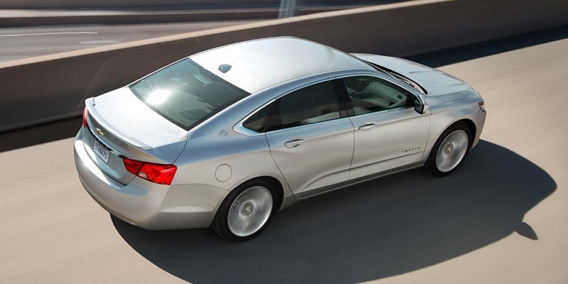 Silver 2020 Chevy Impala overhead driving