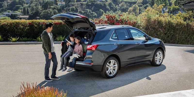 2021 Chevy Equinox kids sitting in open trunk