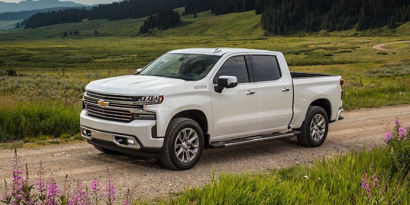 White 2021 Chevy Silverado 1500 in grassy field