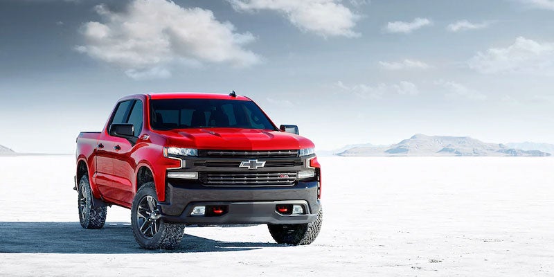 Red 2021 Chevy Silverado in snow covered desert